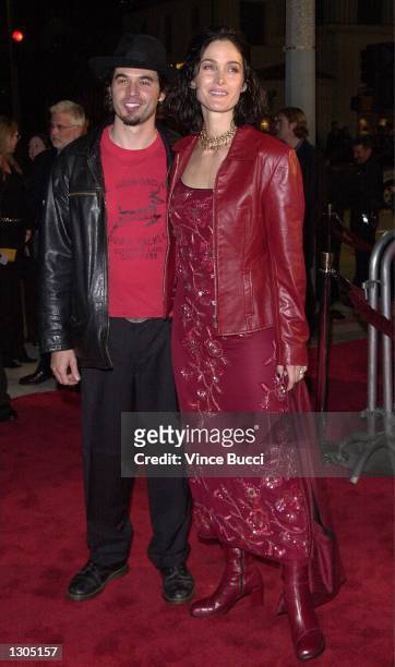 Actress Carrie-Ann Moss and husband actor Steven Roy arrive at the premiere of "Red Planet" on November 6, 2000 in Westwood, CA.