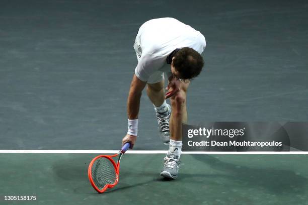 Andy Murray of Great Britain reacts to a missed point in his match by breaking his racquet or racket against Andrey Rublev of Russia during Day 3 of...