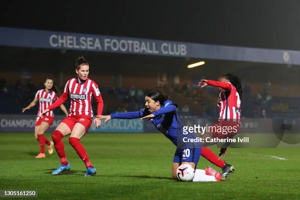 Sam Kerr of Chelsea is fouled by Aissatou Tounkara of Atletico de Madrid leading to a penalty being awarded during the Women's UEFA Champions League...