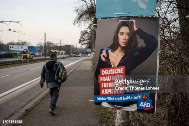 Campaign poster of the right-wing AfD party for the state elections in Rhineland-Palatinate shows a woman in a lazy pose with the slogan 'German...