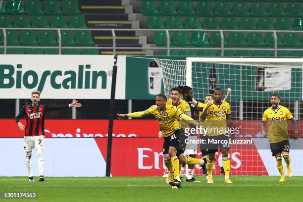 Rodrigo Becao of Udinese Calcio celebrates after scoring their side's first goal during the Serie A match between AC Milan and Udinese Calcio at...