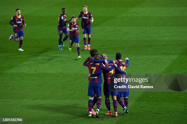 Martin Braithwaite of FC Barcelona celebrates with Antoine Griezmann and Lionel Messi after scoring their side's third goal during the Copa del Rey...