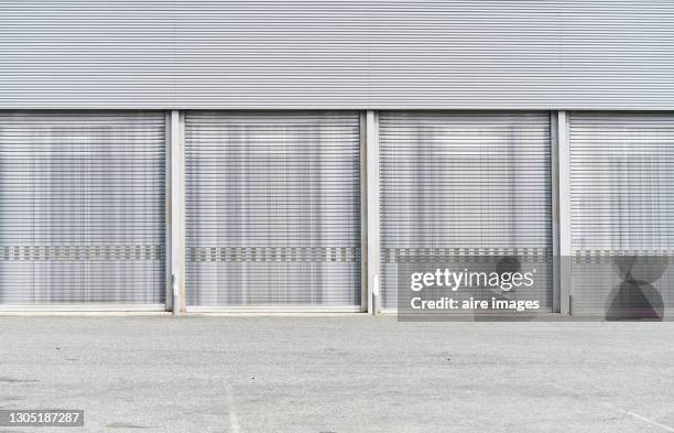 front view of the workshop garage doors. - door canopy stock pictures, royalty-free photos & images