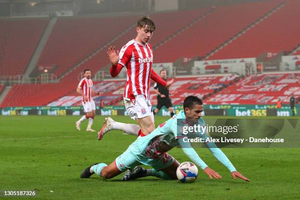 Kyle Naughton of Swansea City is brought down by Jack Clarke of Stoke City for a penalty during the Sky Bet Championship match between Stoke City and...