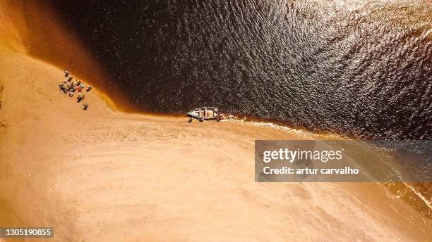 small boat in the river, dramatic landscape from angola - angola water stock pictures, royalty-free photos & images