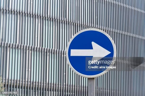 traffic sign indicating the direction of the street. - one direction stock pictures, royalty-free photos & images