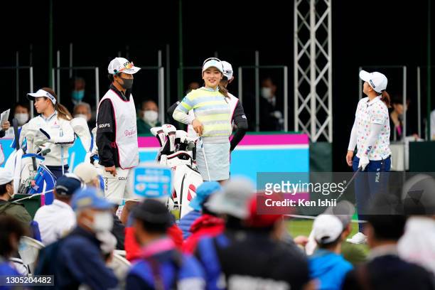 Hikaru Yoshimoto, Rei Matsuda and Mao Saigo of Japan are on the 1st tee where fans surround them during the first round of the Daikin Orchid Ladies...