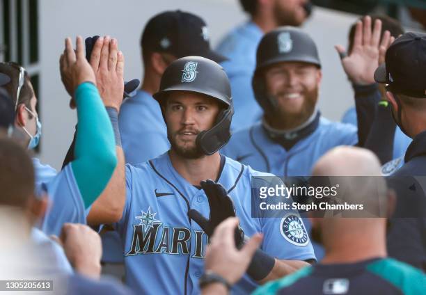 Jack Reinheimer of the Seattle Mariners reacts after his home run against the Chicago Cubs in the ninth inning on March 03, 2021 at Sloan Park in...