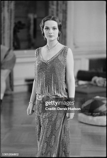 American actress Lois Chiles, a former fashion model, pictured on the film set of Death on the Nile wearing a diamond necklace choker, in which she...