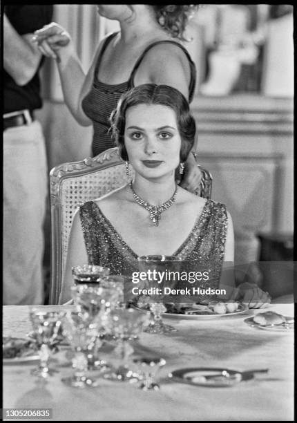 American actress Lois Chiles, a former fashion model, pictured on the film set of Death on the Nile wearing a diamond necklace choker, in which she...