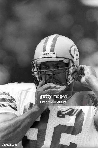 Reggie White of the Green Bay Packers plays against the Los Angeles Raiders at the Pro Football Hall of Fame Game at Fawcett Stadium on July 31, 1993...