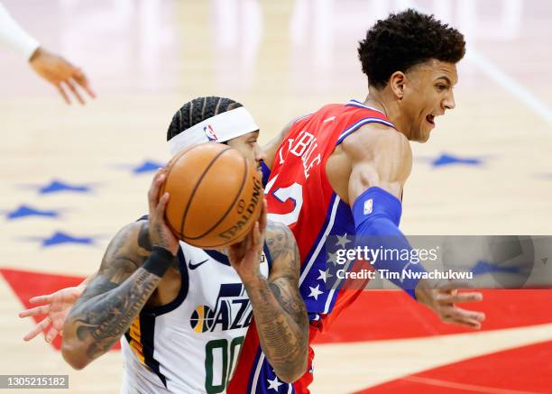 Matisse Thybulle of the Philadelphia 76ers tries to steal the ball from Jordan Clarkson of the Utah Jazz during the second quarter at Wells Fargo...