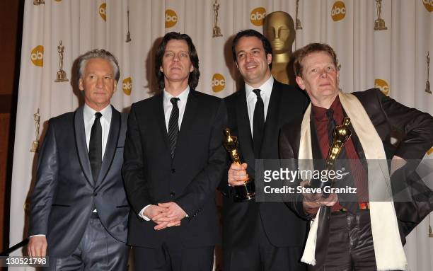 Presenter Bill Maher poses with director James Marsh, producer Simon Chinn and acrobat Philippe Petit in the 81st Annual Academy Awards press room...