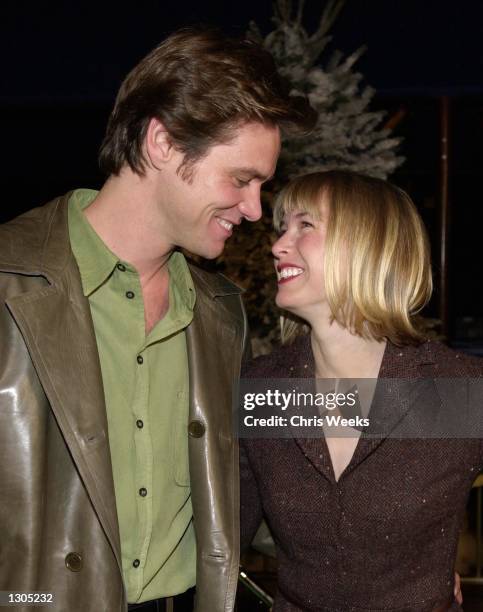 Actor/comedian Jim Carrey and girlfriend Renee Zellweger attend the premiere of Dr. Seuss'' "How The Grinch Stole Christmas" November 8, 2000 at...