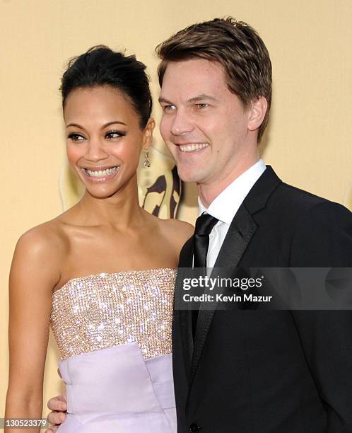 Actress Zoe Saldana and guest arrive at the 82nd Annual Academy Awards at the Kodak Theatre on March 7, 2010 in Hollywood, California.