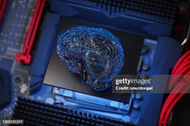 artificial intelligence concept, human brain model with blue plexus lines and red connection dots on motherboard. - bci stock pictures, royalty-free photos & images