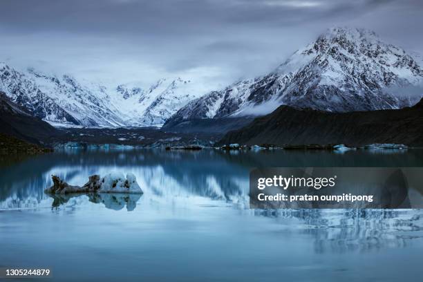 iceberg on tasman glacier lake - mount cook stock pictures, royalty-free photos & images