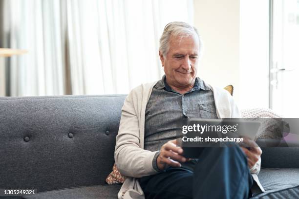 technology keeps me connected during lockdown - one senior man only stock pictures, royalty-free photos & images