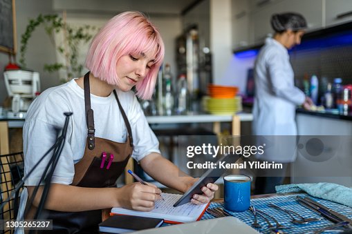 University Student working at cafe for her payments University Student working at cafe for her payments