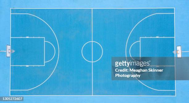 aerial images over blue basketball courts - basketball stock-fotos und bilder