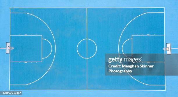 aerial images over blue basketball courts - basketball ball stock pictures, royalty-free photos & images