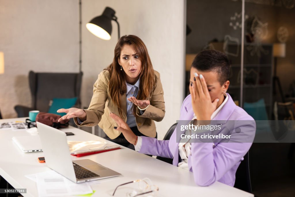 Angry female boss unhappy with female employee performance