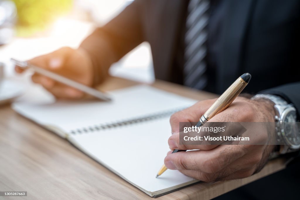Hand Making Notes Close Up Businessman Hands Making Notes In Notebook High-Res Stock ...