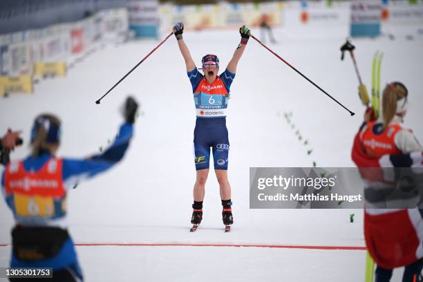 Krista Parmakoski of Finland celebrates winning the bronze medal during the Women's Cross Country 4x5 km Relay at the FIS Nordic World Ski...