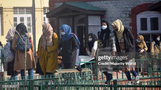 Students walk into classroom. Colleges were closed due to the coronavirus. After 12 months colleges have reopened. Srinagar.