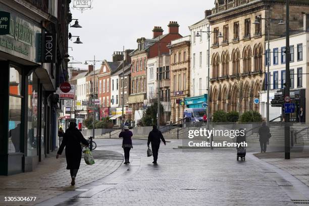 People walk through the centre of Darlington after it was announced by the Chancellor of the Exchequer Rishi Sunak that the town will become the...