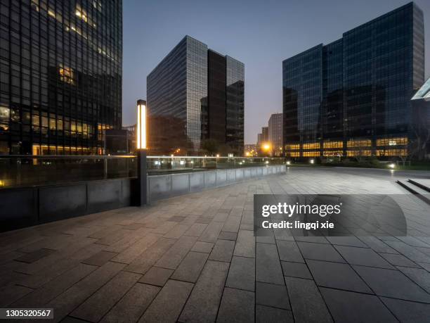 facades of modern buildings in the business district of hangzhou, china in the evening - evening foto e immagini stock