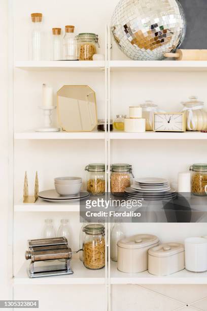 glass jars with metal lids for storing soups, cereals and pasta. - organised shelves imagens e fotografias de stock