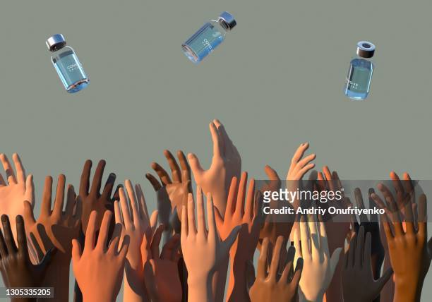 people's hands trying to catch covid-19 vaccine bottles - lining up for vaccine stock pictures, royalty-free photos & images