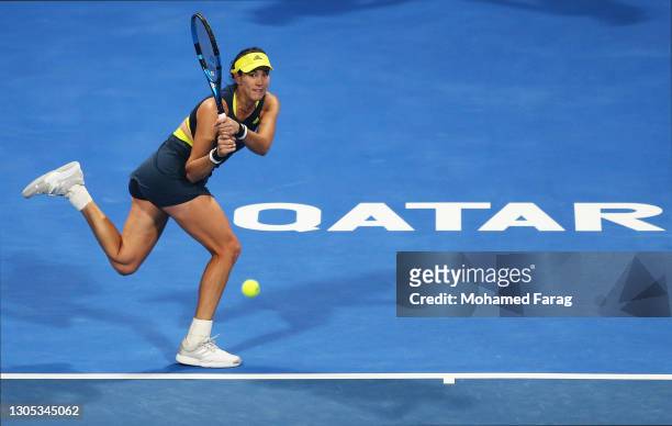 Garbine Muguruza of Spain plays a backhand in her Quarter-Final singles match against Maria Sakkari of Greece during Day Four of the Qatar Total Open...