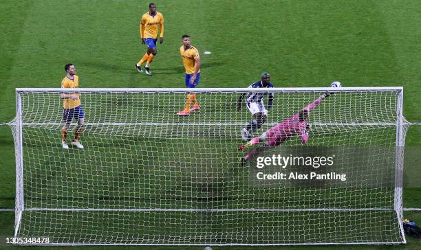 Jordan Pickford of Everton makes a save from a header by Mbaye Diagne of West Bromwich Albion during the Premier League match between West Bromwich...