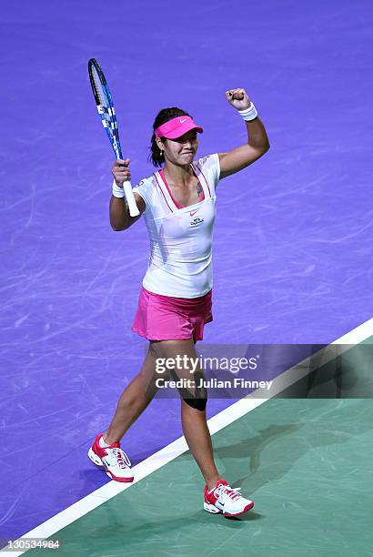 Na Li of China celebrates defeating Maria Sharapova of Russia during day two of the season ending TEB BNP Paribas WTA Championships Tennis at the...