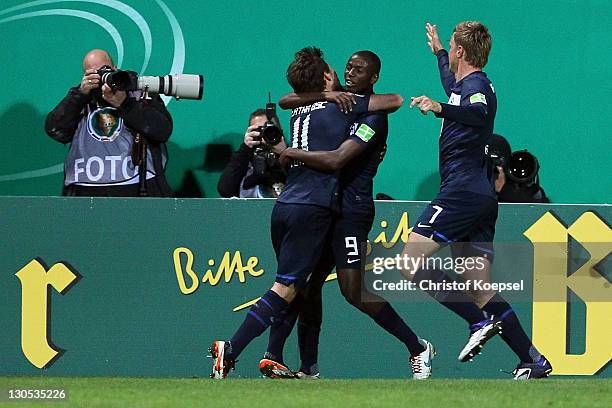Adrián Ramos celebrates the first goal with Tunay Torun and Maik Franz of Berlin during the second round DFB Cup match between Rot-Weiss Essen and...