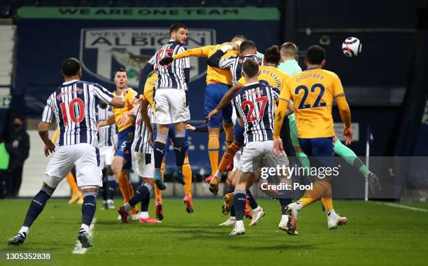 Richarlison of Everton scores their side's first goal past Sam Johnstone of West Bromwich Albion during the Premier League match between West...