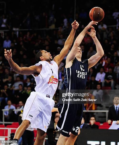 Stanko Barac, #42 of Anadolu Efes competes with Justin Hamilton, #7 of Belgacom Spirou Basket during the 2011-2012 Turkish Airlines Euroleague...