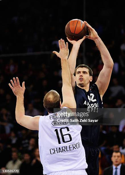Stanko Barac, #42 of Anadolu Efes competes with Christophe Beghin, #16 of Belgacom Spirou Basket during the 2011-2012 Turkish Airlines Euroleague...