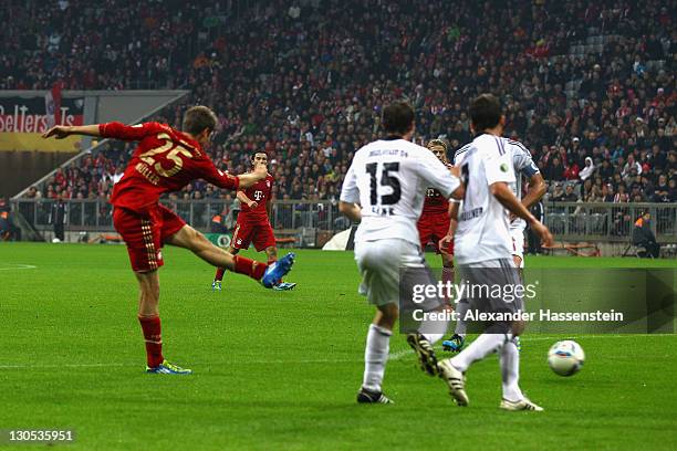 Thomas Mueller of Muenchen scores the opening goal during the DFB Cup second round match between FC Bayern Muenchen and FC Ingolstadt at Allianz...