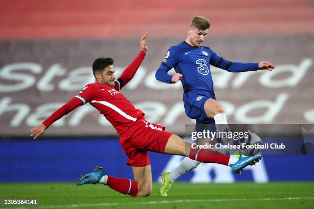 Timo Werner of Chelsea is challenged by Ozan Kabak of Liverpool as he scores a goal which is disallowed following a VAR review during the Premier...