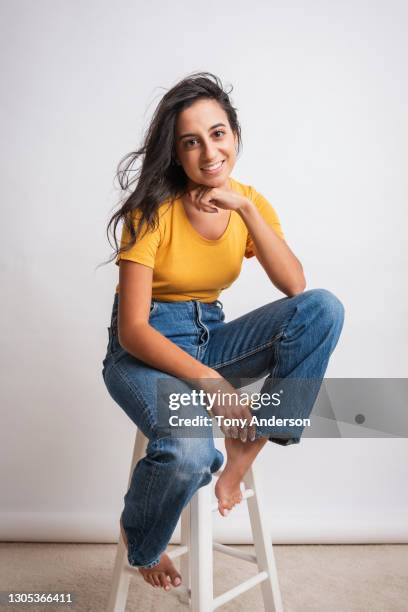 portrait of young middle eastern woman - casual clothing confidence white background stock pictures, royalty-free photos & images