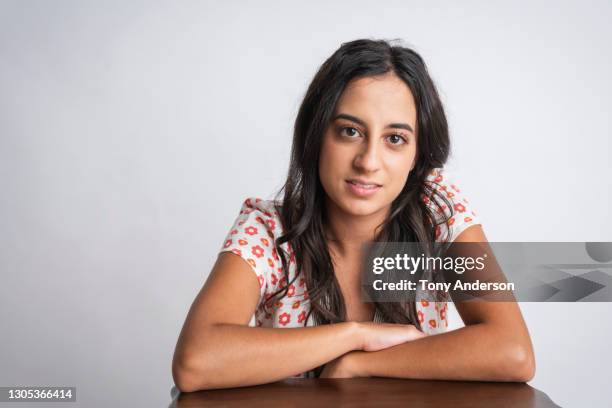 portrait of young middle eastern woman - leaning on elbows stock pictures, royalty-free photos & images