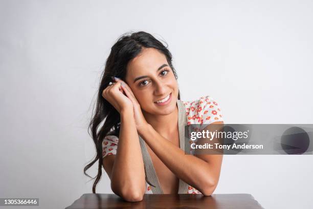 portrait of young middle eastern woman - leaning on elbows stock pictures, royalty-free photos & images