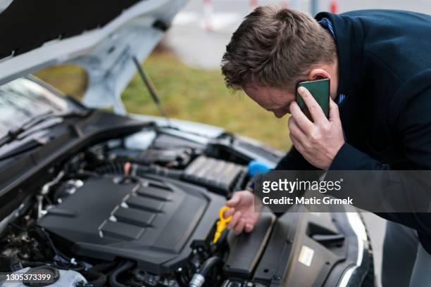young bearded guy having a nightmare with his car - vehicle hood stock pictures, royalty-free photos & images