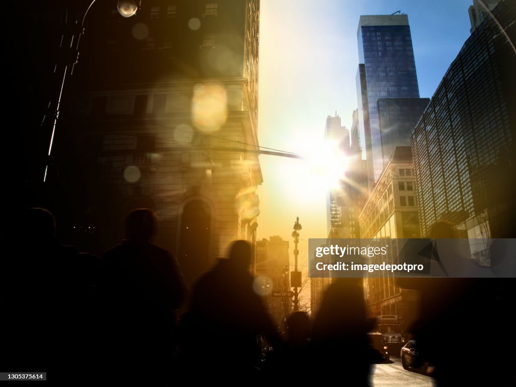 Crowd of people walking on busy street of Manhattan