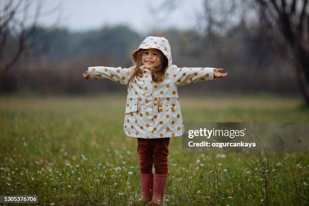 cute girl in countryside. - standing in the rain girl stock pictures, royalty-free photos & images