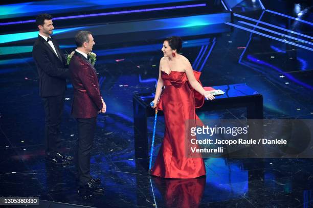 Amadeus and Antonella Ferrari are seen on stage during the 71th Sanremo Music Festival 2021 at Teatro Ariston on March 04, 2021 in Sanremo, Italy.