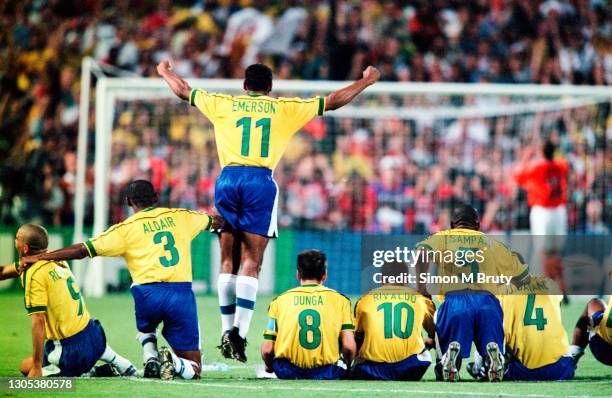 Emerson jumps up as he and the rest of the Brazil team watch as Philip Cocu of Holland misses the second penalty for the Dutch team.The Semi Final of...